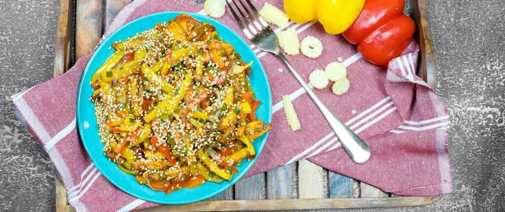 Delicious Chili Baby Corn recipe with a spicy, savory stir-fry and vibrant vegetables.